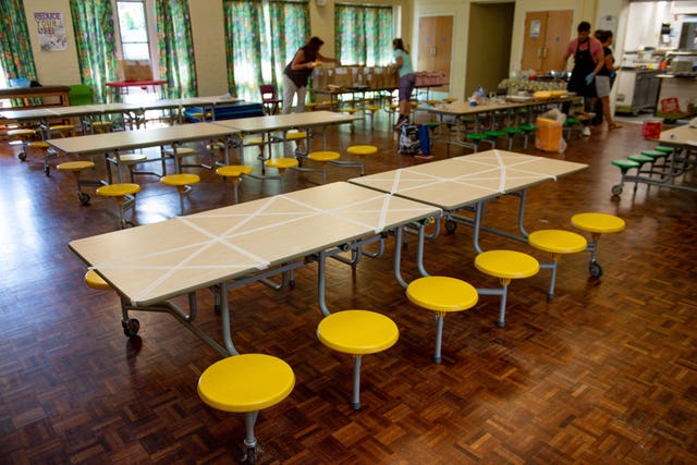 Tables are marked showing where children can sit (Jacob King/PA)