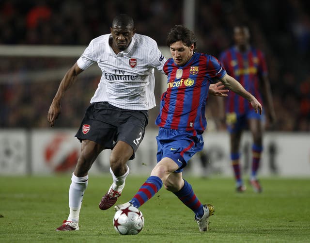 Lionel Messi, battling with Arsenal's Abou Diaby, scored a record 672 goals in 778 games for Barcelona