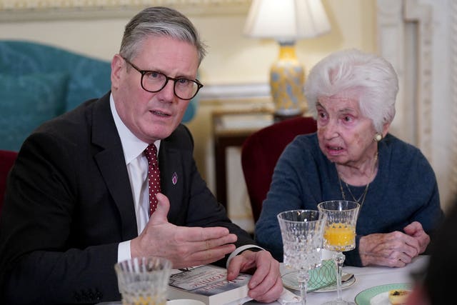 Prime Minister Sir Keir Starmer sits beside Holocaust survivor Renee Salt during a reception to mark Holocaust Memorial Day at 10 Downing Street