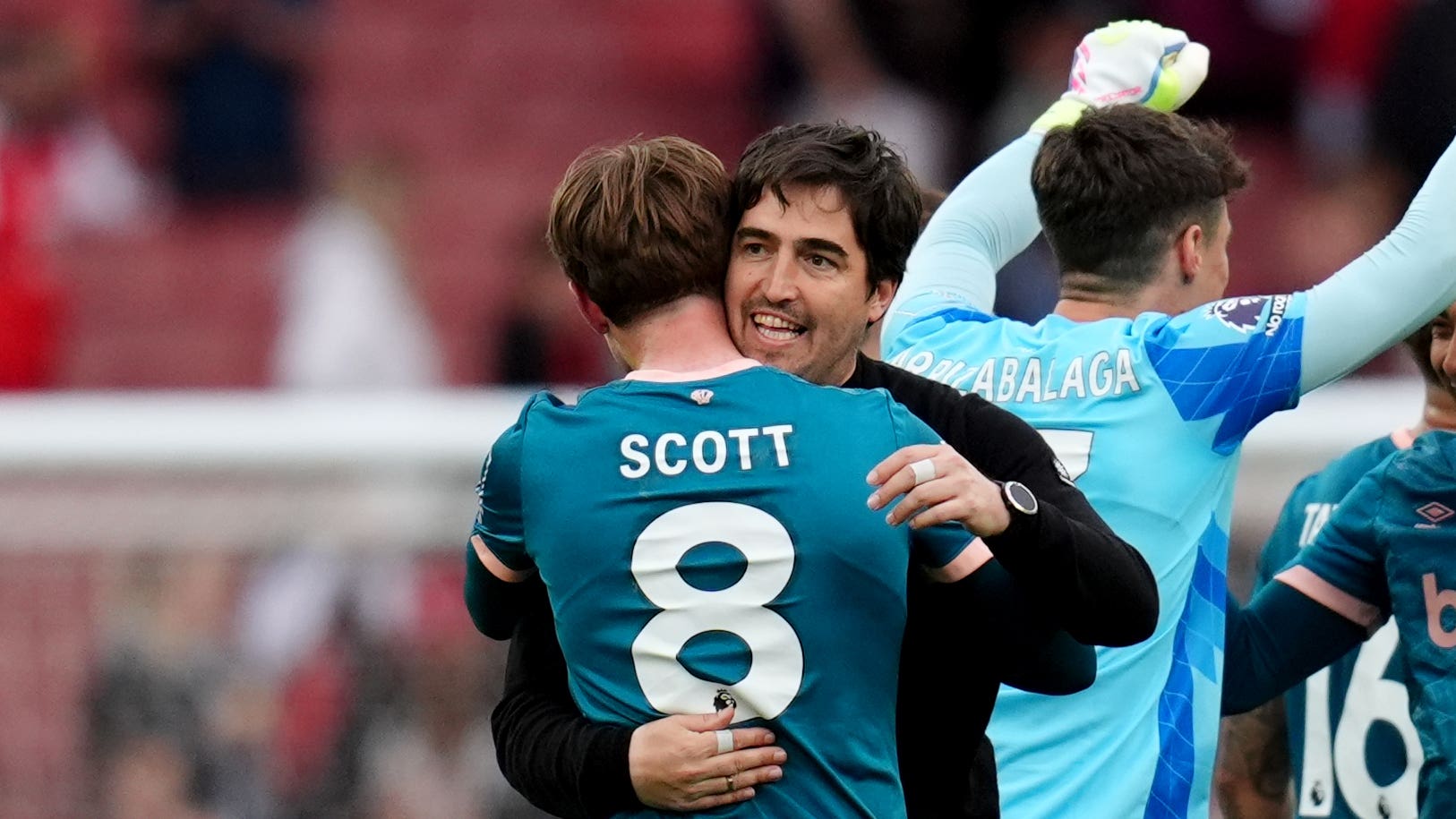 Bournemouth manager Andoni Iraola, right, and substitute Alex Scott, left, embrace at the final whistle PA)