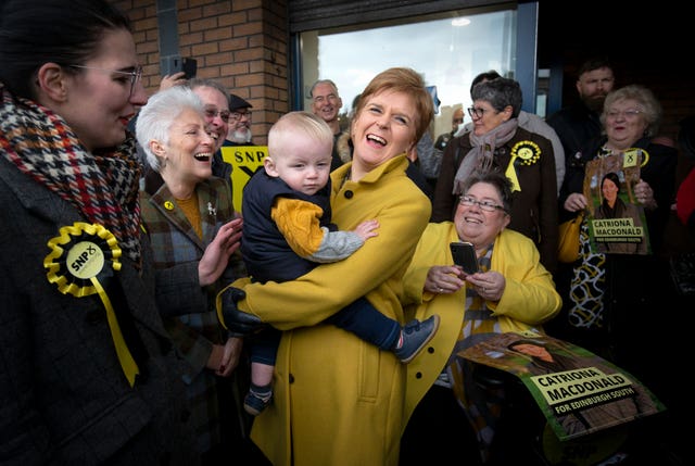 SNP leader Nicola Sturgeon meets 11-month-old Riley Williamson in Gilmerton, Edinburgh