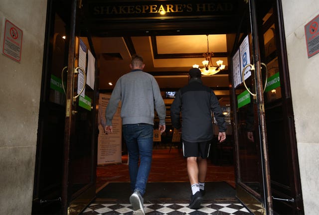 Customers walk into reopened pub