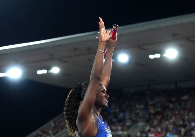 Dina Asher-Smith waves to the Birmingham crowd ahead of the relay final