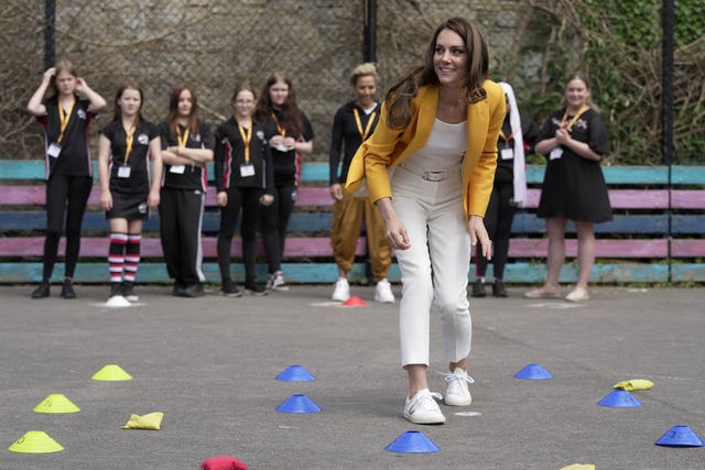Kate takes part in a game of bean-bag noughts and crosses