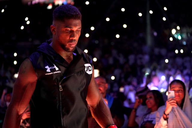 Anthony Joshua makes his way to the ring in Jeddah