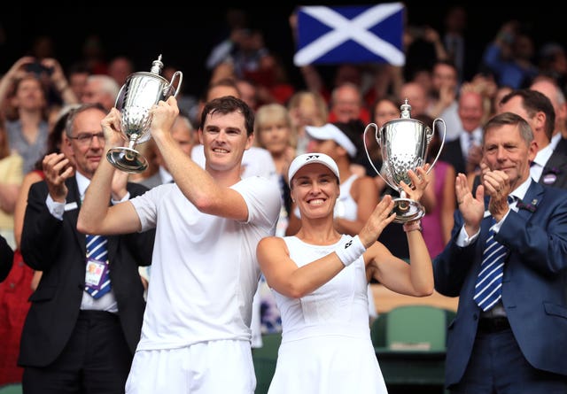 Jamie Murray, left, and Martina Hingis with their 2017 Wimbledon mixed doubles trophies
