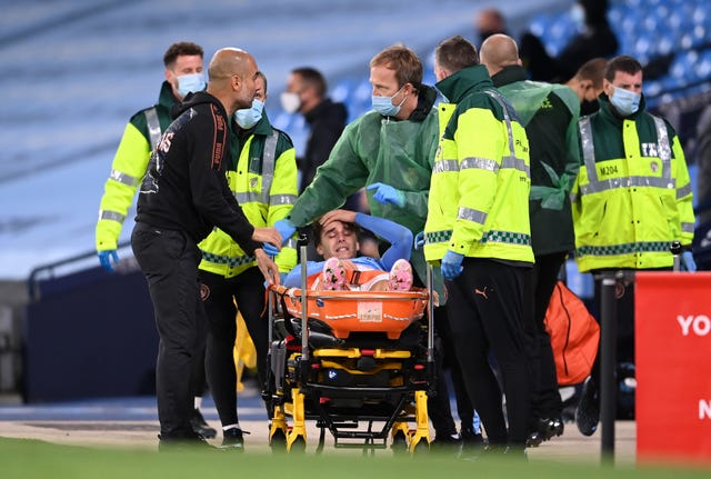 Guardiola (left) showed concern for the injured Adrian Bernabe