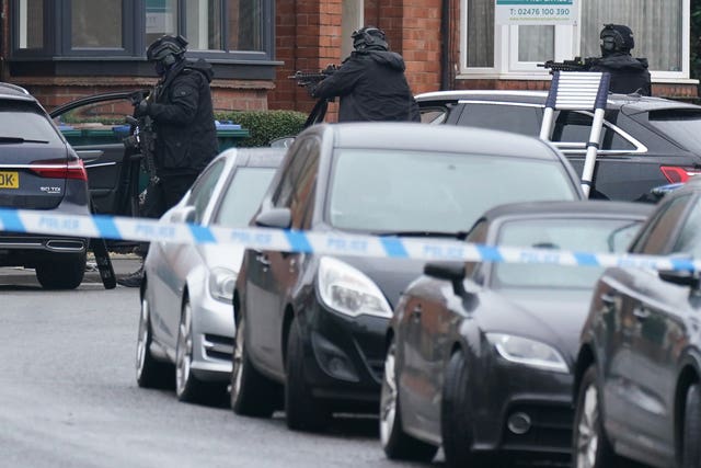 Armed police officers outside a property in Earlsdon Avenue North, Coventry, where police remain in a stand-off with a man 