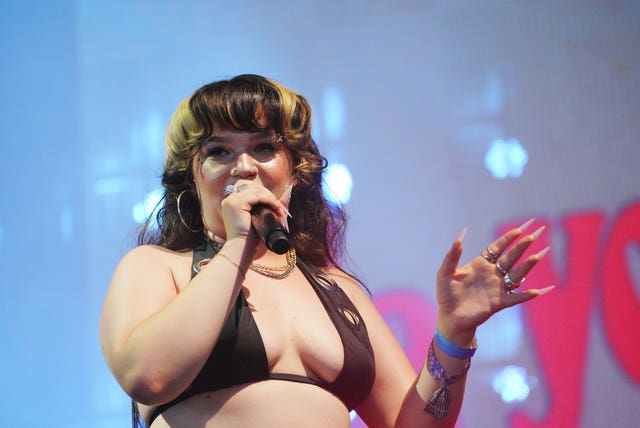 Lola Young performing on Woodsies Stage at Glastonbury Festival