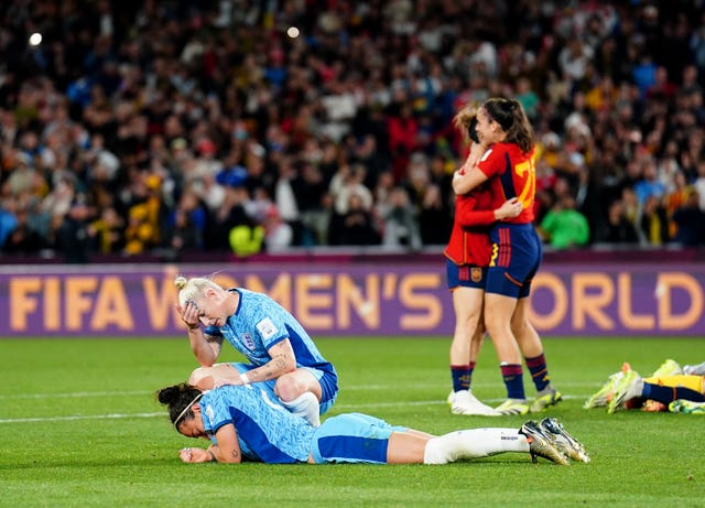 England’s Lucy Bronze and Bethany England digest defeat while Spain celebrate their World Cup victory