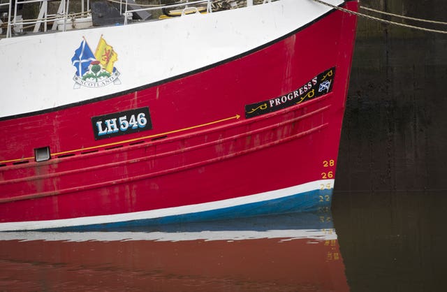A fishing boat moored in Eyemouth Harbour, in the Scottish Borders (Jane Barlow/PA)