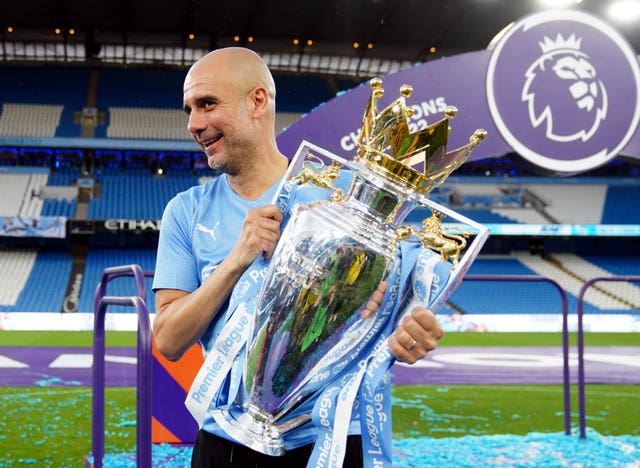 Pep Guardiola with the Premier League trophy in 2022