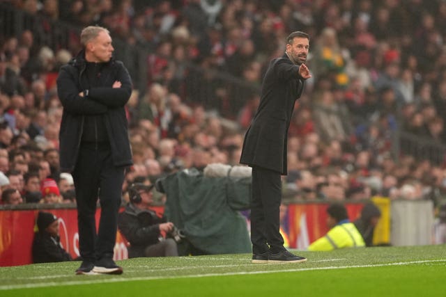 Steve Cooper and Ruud van Nistelrooy on the touchline