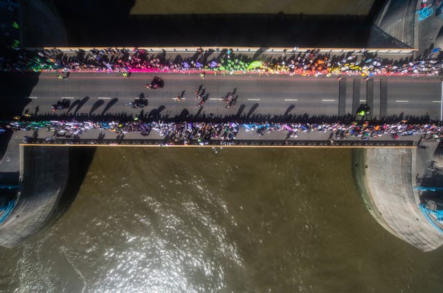 The Elite Men reach the halfway point, as seen from Tower Bridge Exhibition's Glass Floor (Steven Paston/PA)