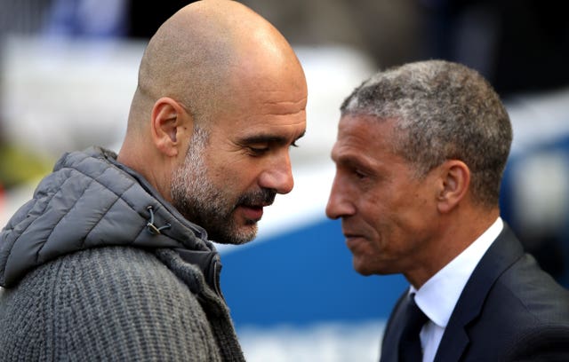 Chris Hughton (right) came up against Pep Guardiola's champions Manchester City in his final game in charge. 