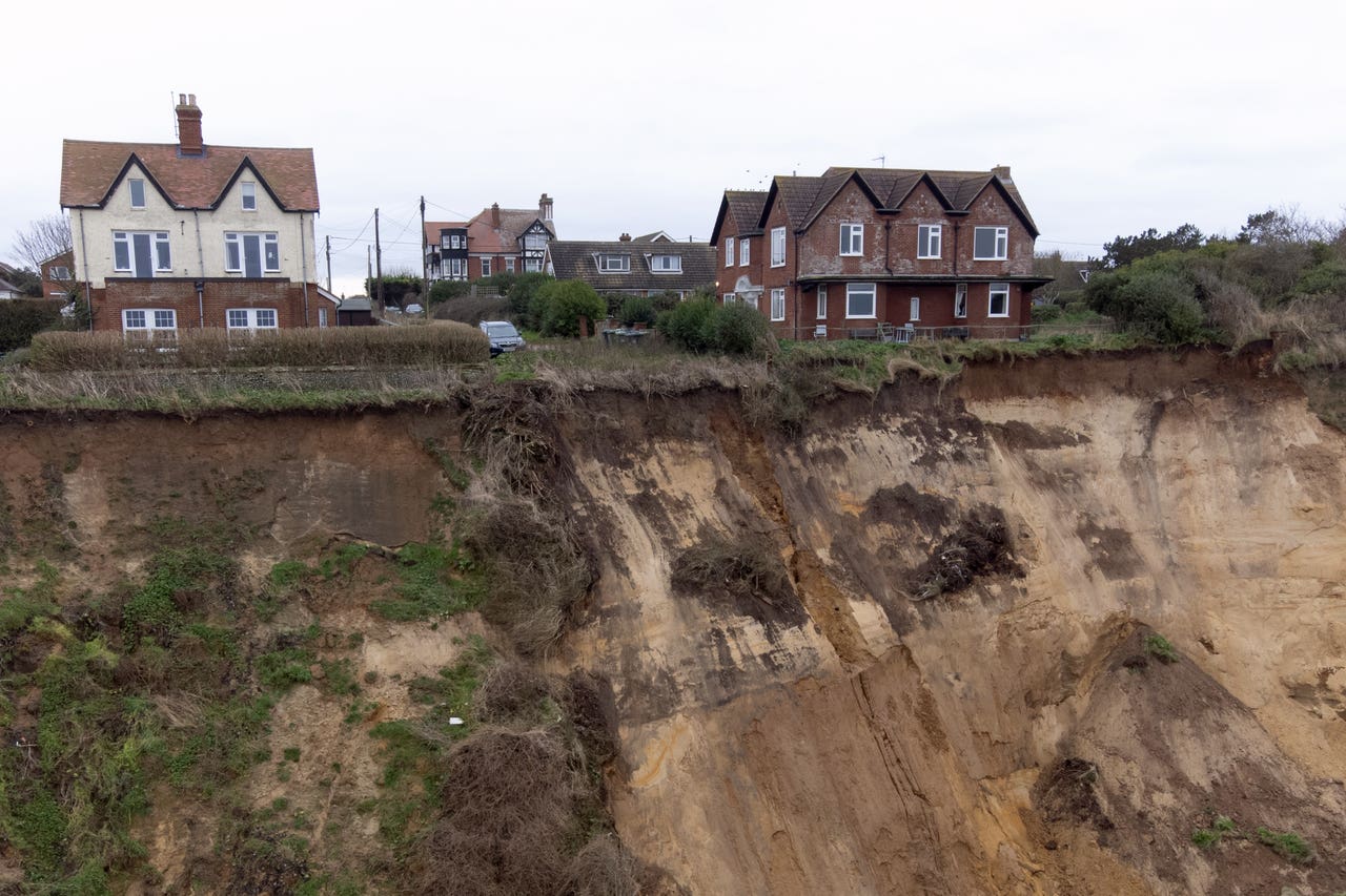 Cliff collapse leaves local residents scared and wanting to move house ...