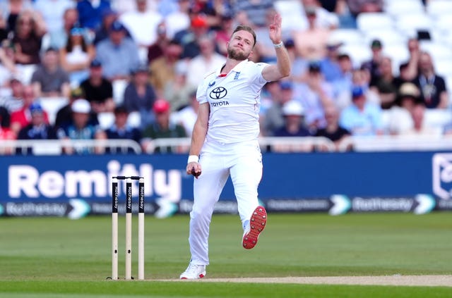Sam Cook bowling for England