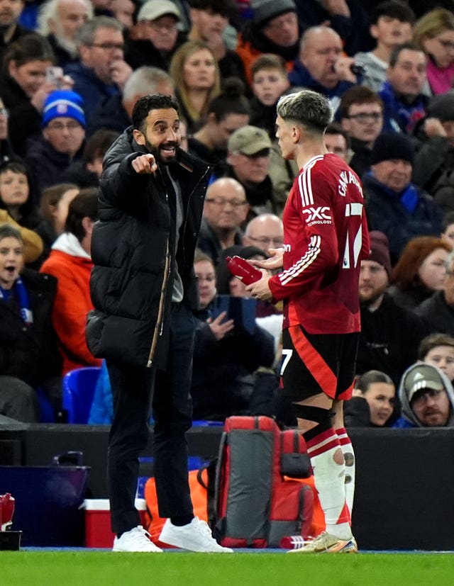 Alejandro Garnacho, right, receives instructions from Manchester United manager Ruben Amorim