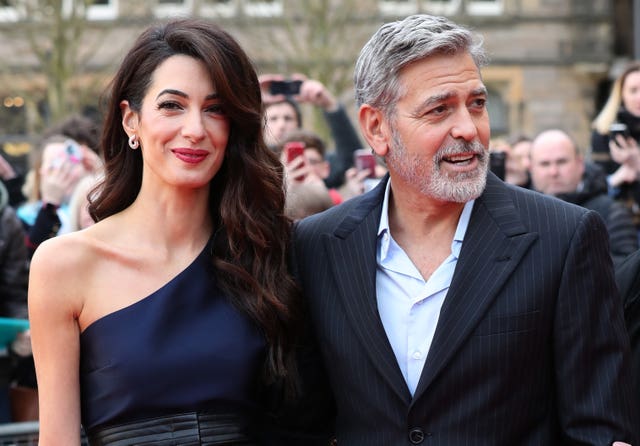 George and Amal Clooney, representing the Clooney Foundation for Justice, arrive at the People’s Postcode Lottery charity gala at the McEwan Hall in Edinburgh