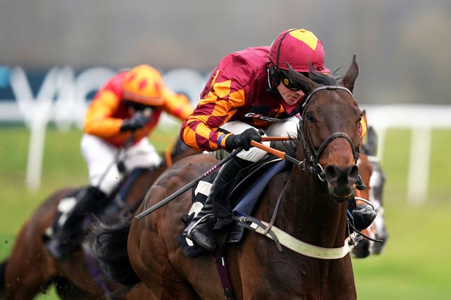 Emitom ridden by jockey Tom Cannon on their way to winning the Play Pick 6 at Betvictor Handicap Hurdle (Qualifier) at Newbury Racecourse