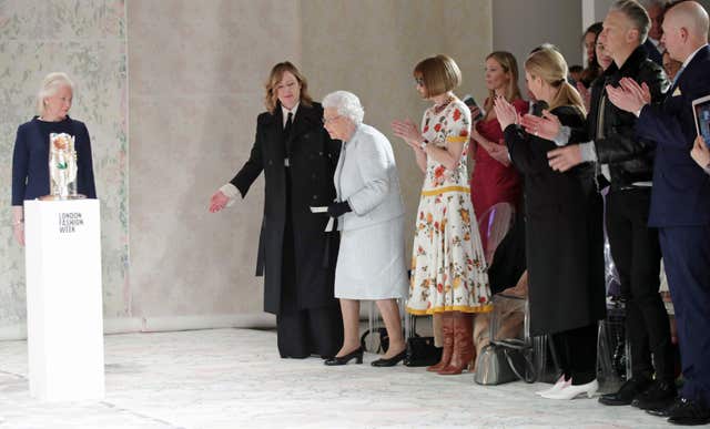 The Queen steps onto the catwalk (Yui Mok/PA)