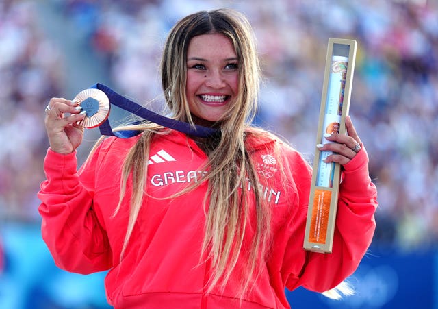 Sky Brown celebrates with her bronze medal at the Paris Olympic Games