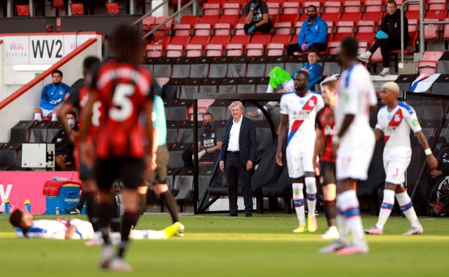 Crystal Palace manager Roy Hodgson, centre, signed a new one-year contract just before the Premier League was suspended due to the coronavirus pandemic 