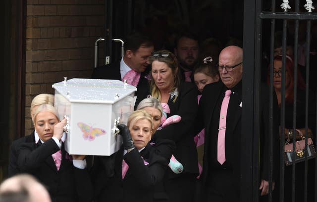 Olivia’s mother Cheryl Korbel walks behind her daughter's coffin as it is carried out of St Margaret Mary’s Church in Knotty Ash, Liverpool (Peter Powell/PA)