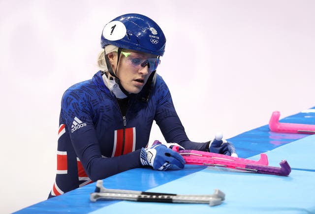 Great Britain’s Elise Christie prepares to leave the ice after being disqualified from her re-started 1000m short track speed skating heat 