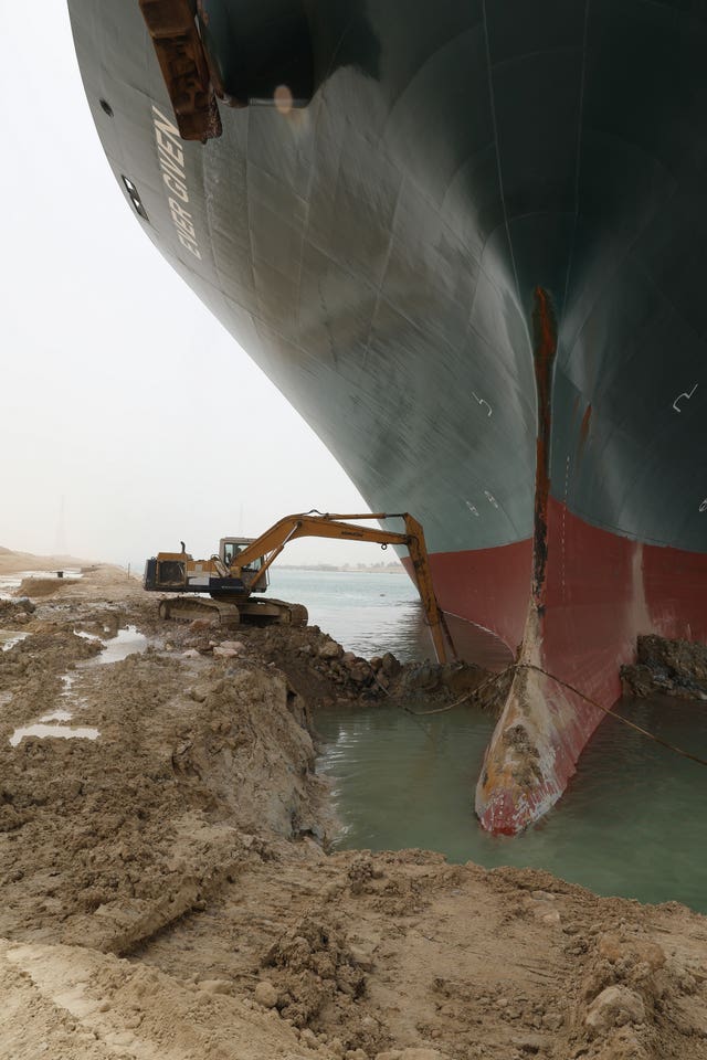 A digger being used to free the Ever Given from the Suez Canal (Suez Canal Authority/PA)