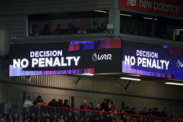 The VAR screen shows a ‘No Penalty’ decision at Anfield