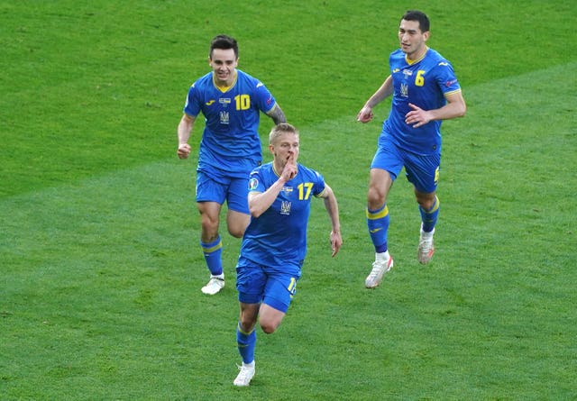 Manchester City's Oleksandr Zinchenko (centre) is a key figure in the Ukraine side