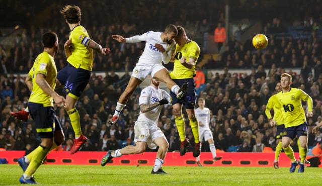 Kemar Roofe heads in a dramatic stoppage-time winner after Leeds recovered from falling behind to Blackburn in the 90th minute to win 3-2