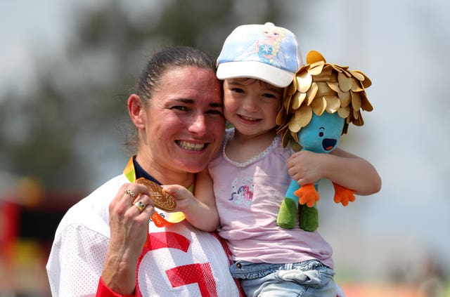 Louisa celebrates with her mother after Sarah Storey added another gold medal to the collection 