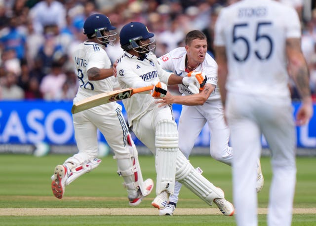 India batter Ravindra Jadeja, centre, collides with England bowler Brydon Carse, right, at Lord's