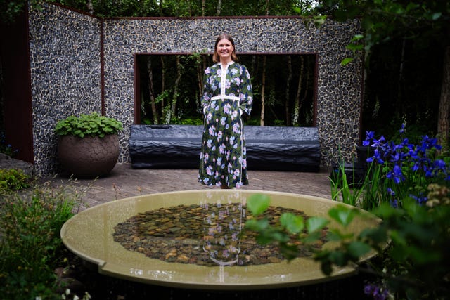 Ula Maria poses in her Forest Bathing Garden, at the RHS Chelsea Flower 