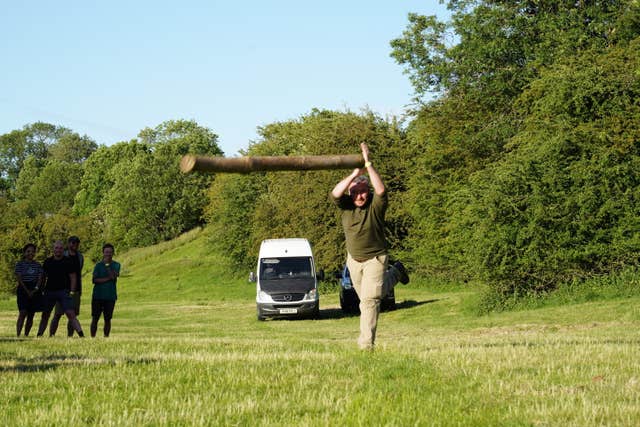 Man tossing a pillar