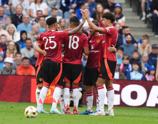 Man United players celebrate a goal