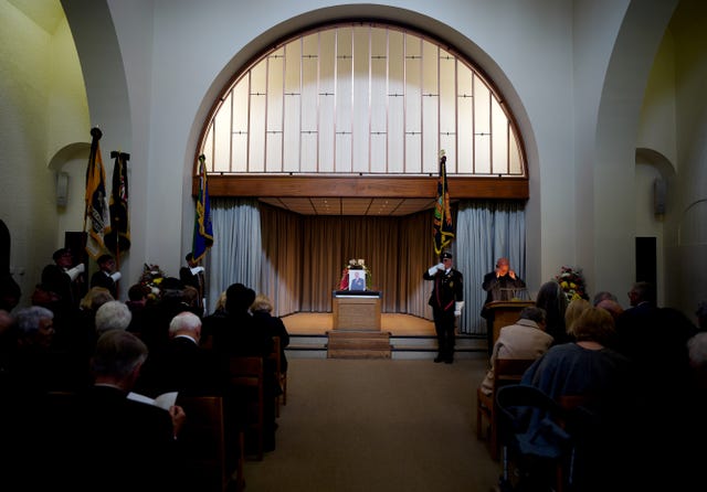 Mourners attend the funeral of D-Day veteran Albert Price, 98.