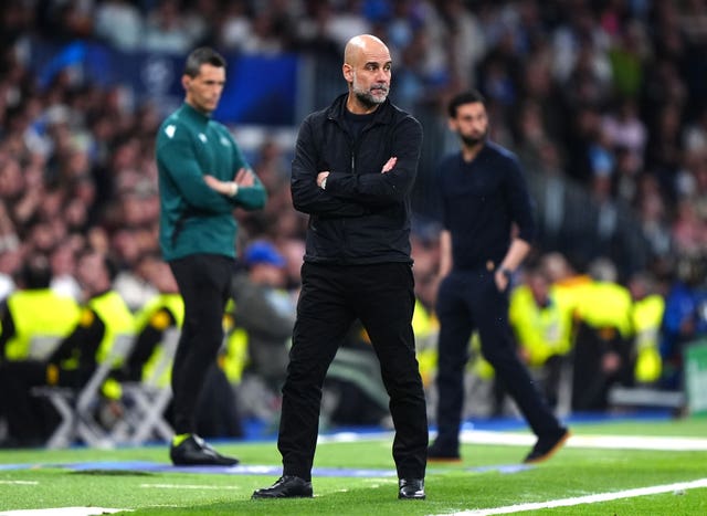 Manchester City manager Pep Guardiola looks on