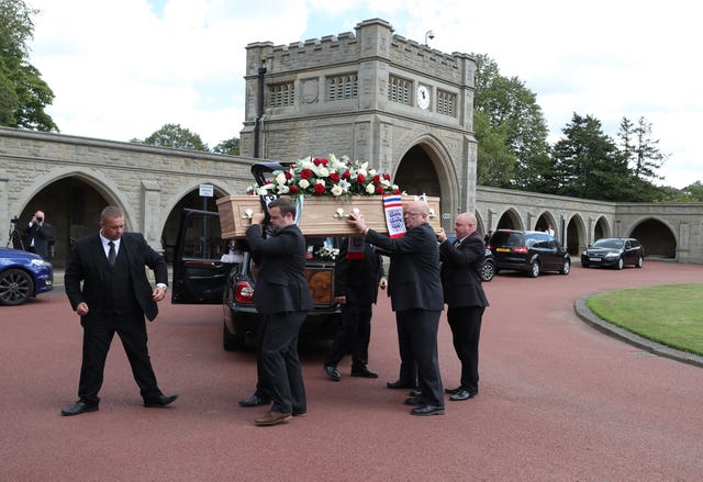 The coffin of Jack Charlton is taken into West Road Crematorium in Newcastle for his funeral 