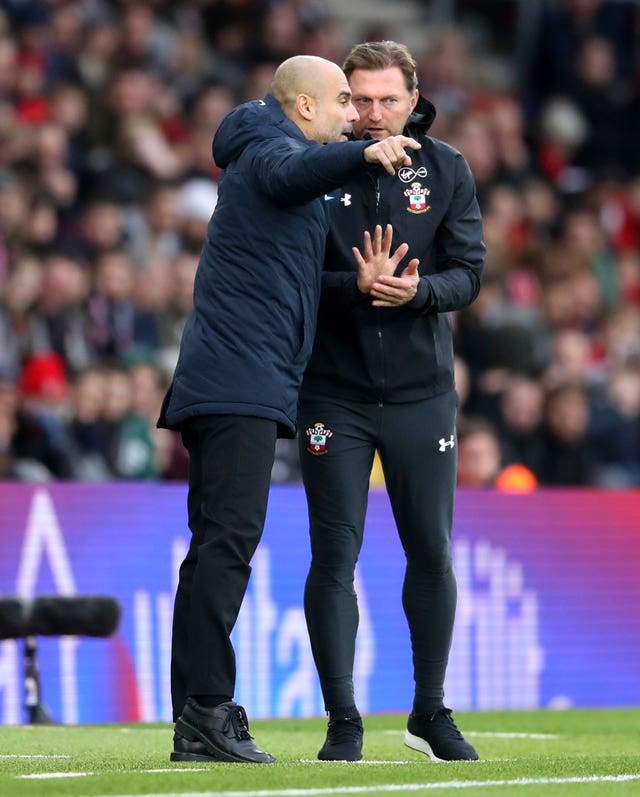 Manchester City boss Pep Guardiola, left, deep in conversation with Southampton counterpart Ralph Hasenhuttl on the touchline