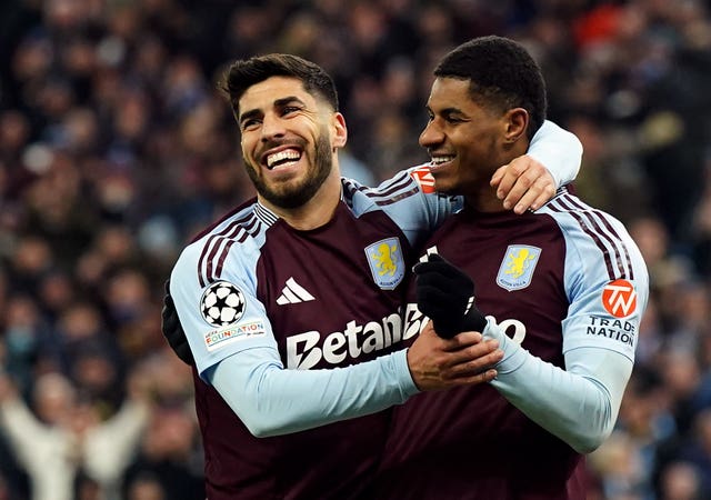 Marco Asensio, left, celebrates with Marcus Rashford after scoring for Aston Villa against Club Brugge