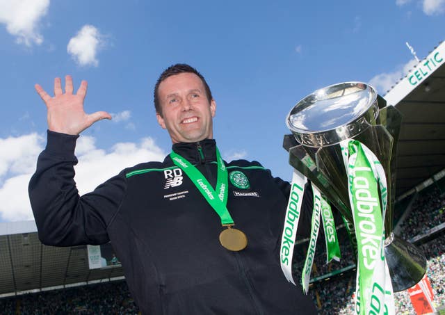 Ronny Deila with the Premiership trophy after a 7-0 win over Motherwell in his last game