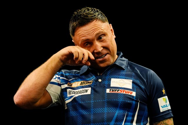 Gerwyn Price reacts on stage