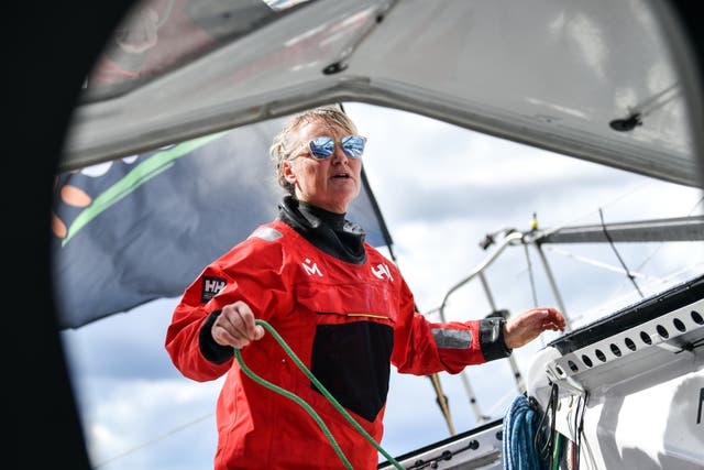 British sailor Pip Hare preparing on the Medallia in Helly Hansen kit ahead of the Vendee Globe 2024