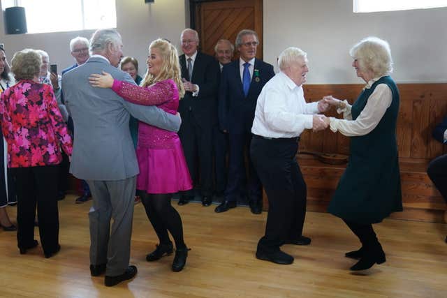 The Prince of Wales and the Duchess of Cornwall dancing at the Bru Boru Cultural Centre in Cashel, Co Tipperary