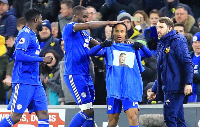 Cardiff's Bobby Reid holds up a shirt in honour of the missing Emiliano Sala after scoring against Bournemouth (Mark Kerton/PA).