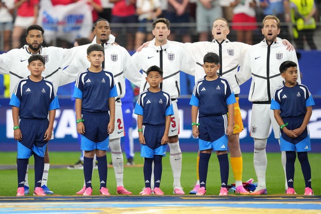 England players stand for the national anthem before Wednesday's World Cup match against Croatia