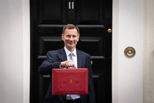 Chancellor of the Exchequer Jeremy Hunt leaves 11 Downing Street, London, with his ministerial box before delivering his Budget at the Houses of Parliament